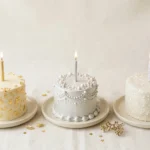 Three birthday cakes decorated in gold, silver and sparkling diamond styles representing a golden birthday, platinum birthday and diamond birthday